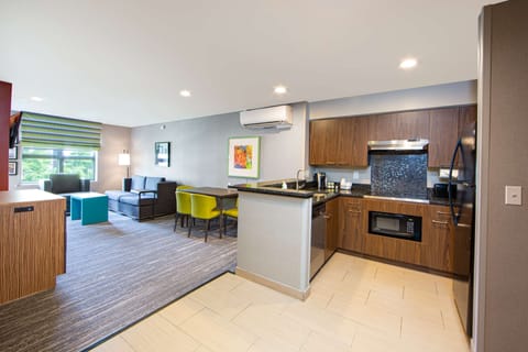 Suite, 2 Bedrooms | Living area | 40-inch flat-screen TV with cable channels, TV