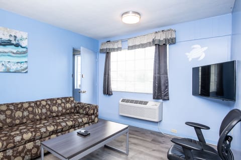 Standard Suite, 2 Bedrooms (Kitchenware not included) | Living area | 40-inch LED TV with satellite channels, TV