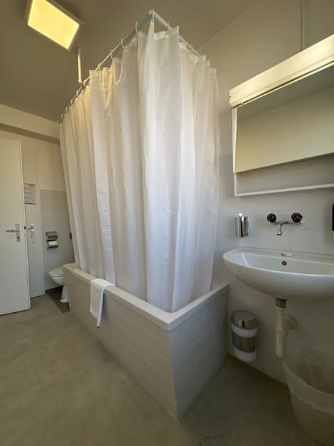 Basic Quadruple Room | Bathroom | Shower, free toiletries, hair dryer