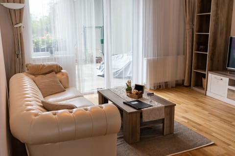 Design Studio Suite | Living area | 55-inch flat-screen TV with cable channels, Smart TV