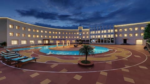2 outdoor pools, open 7:00 AM to 7:00 PM, pool umbrellas