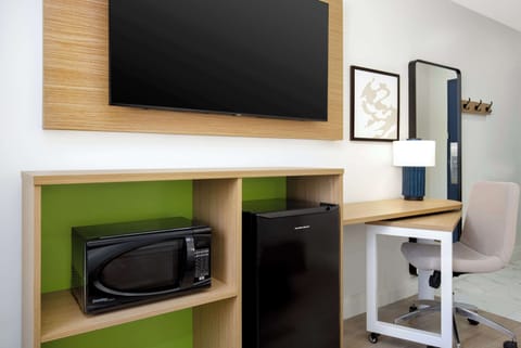 Desk, laptop workspace, blackout drapes, iron/ironing board