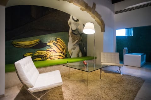 Master suite with bathtub and terrace | Living room | 52-inch Smart TV with cable channels, first-run movies