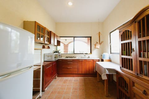 Family Cottage | Private kitchenette | Fridge, dining tables
