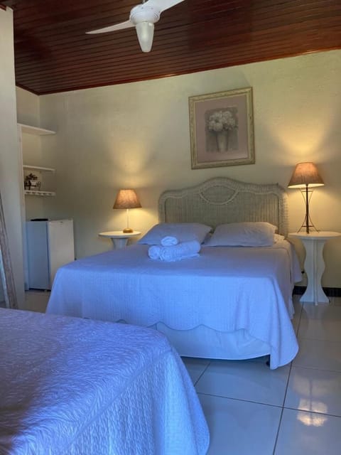 Family Triple Room | Down comforters, minibar, individually decorated, individually furnished