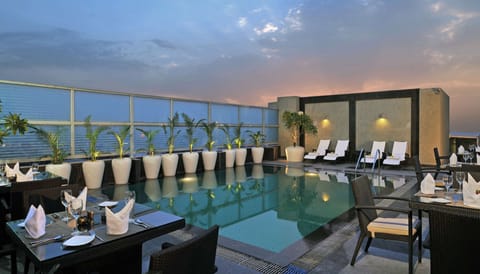Outdoor pool, pool umbrellas, sun loungers
