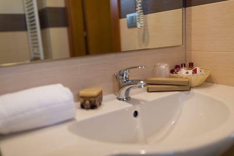 Shower, free toiletries, hair dryer, slippers