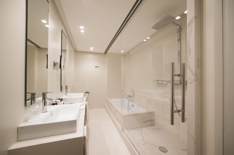 Luxury King Room | Bathroom | Designer toiletries, hair dryer, bathrobes, slippers
