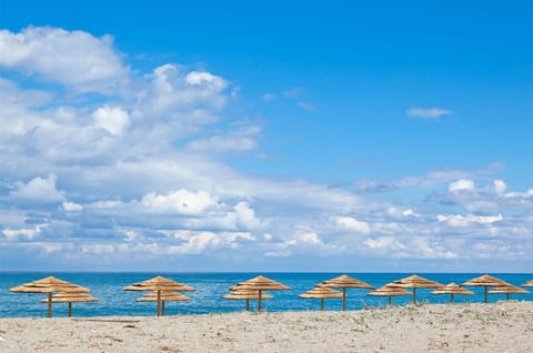 Beach nearby, white sand, beach towels