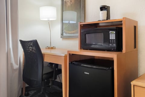 Desk, blackout drapes, iron/ironing board, bed sheets