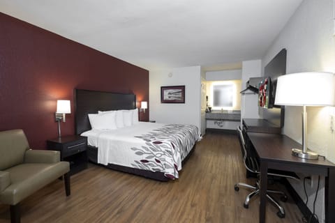 Desk, laptop workspace, iron/ironing board, free cribs/infant beds