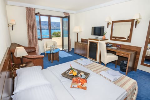 Family Room, Balcony, Sea View | Minibar, in-room safe, desk, laptop workspace