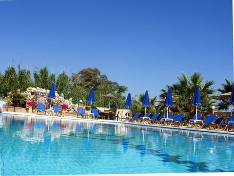 Seasonal outdoor pool, open 9:00 AM to 9:00 PM, pool umbrellas