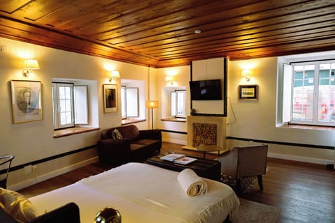 Suite, Balcony | Minibar, desk, laptop workspace, blackout drapes