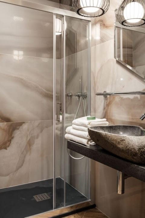 Shower, free toiletries, hair dryer, bathrobes