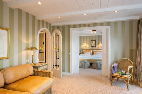 Superior Suite | Living area | Flat-screen TV