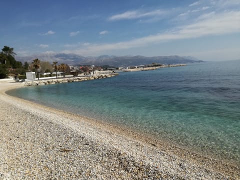 Beach nearby, white sand, beach towels
