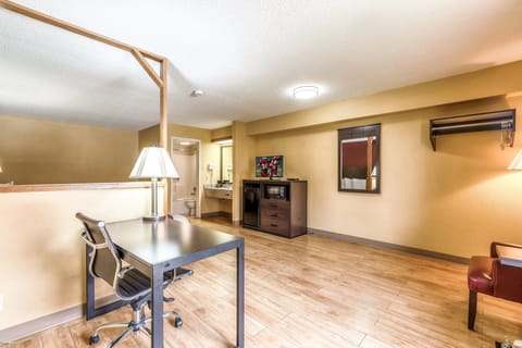 Desk, laptop workspace, iron/ironing board, free cribs/infant beds