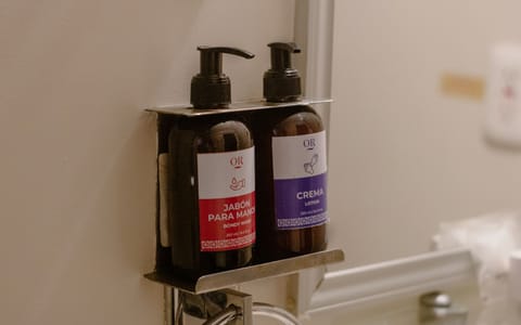 Shower, rainfall showerhead, designer toiletries, towels