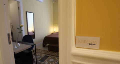 Double Room, Private Bathroom (Robusta) | Minibar, individually decorated, individually furnished, desk