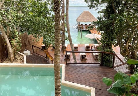 Outdoor pool, open 8:00 AM to 8:00 PM, pool umbrellas