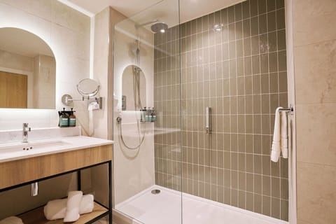 Suite, 1 Bedroom | Bathroom | Combined shower/tub, rainfall showerhead, free toiletries, hair dryer