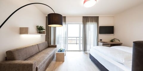 Junior Suite, Balcony | Minibar, in-room safe, desk, soundproofing