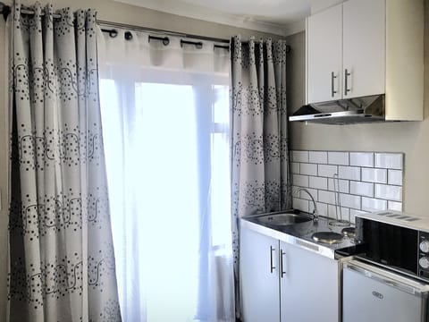 Mini-fridge, microwave, coffee/tea maker, electric kettle