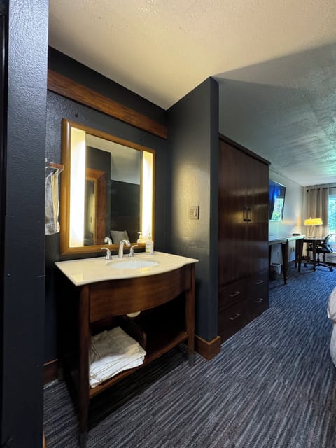 Premium bedding, desk, laptop workspace, blackout drapes