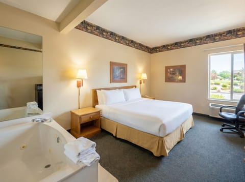 Room, 1 King Bed, Jetted Tub | Desk, free WiFi, bed sheets