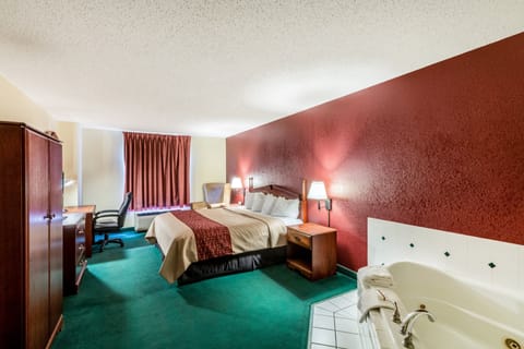 Deluxe Room, 1 King Bed, Non Smoking, Jetted Tub | Desk, blackout drapes, iron/ironing board, free cribs/infant beds