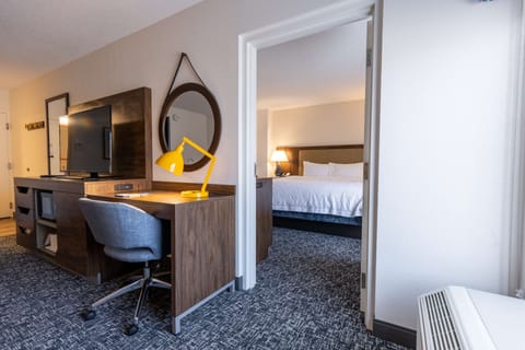 Suite, 1 King Bed | Desk, blackout drapes, iron/ironing board, WiFi