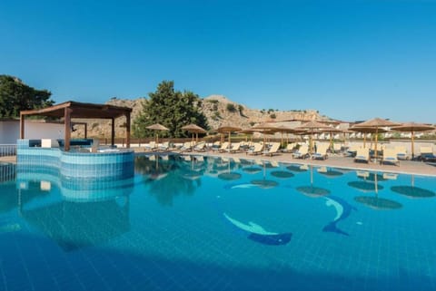 Seasonal outdoor pool, open 10:00 AM to 6:00 PM, pool umbrellas
