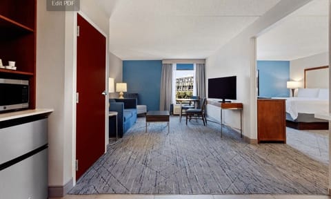 Suite, 1 King Bed, River View (Additional Living Area) | Premium bedding, down comforters, pillowtop beds, individually decorated