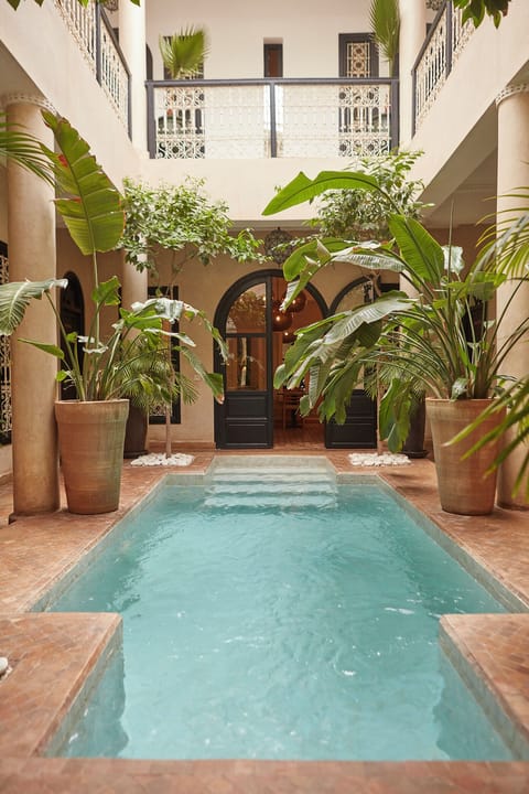 Outdoor pool, pool umbrellas, sun loungers