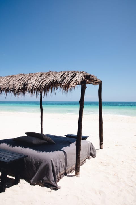 On the beach, sun loungers, beach towels