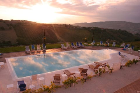 Seasonal outdoor pool, open 8:00 AM to 7:00 PM, sun loungers