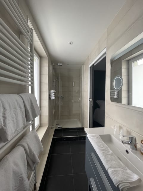 Family Quadruple Room, Multiple Beds, City View | Bathroom | Hair dryer, towels