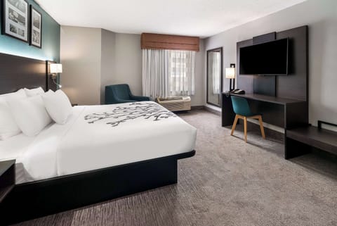 Desk, laptop workspace, blackout drapes, iron/ironing board