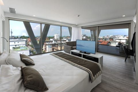 Deluxe Suite, Terrace, Partial Sea View | Minibar, in-room safe, desk, soundproofing