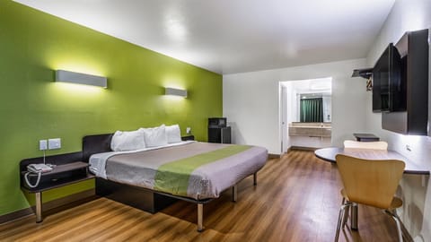 Desk, blackout drapes, bed sheets