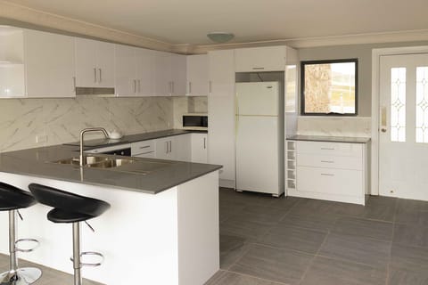 Full-size fridge, stovetop, coffee/tea maker, electric kettle