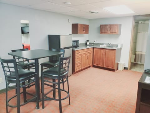 Family Suite (2 Queen) | Private kitchen | Fridge, microwave, coffee/tea maker