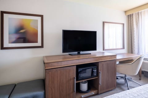 Premium bedding, desk, laptop workspace, iron/ironing board