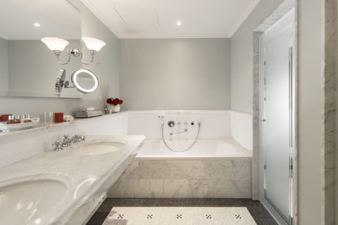 Combined shower/tub, designer toiletries, hair dryer, bathrobes