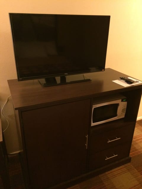 Desk, laptop workspace, blackout drapes, travel crib