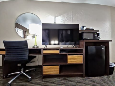 Desk, laptop workspace, blackout drapes, iron/ironing board