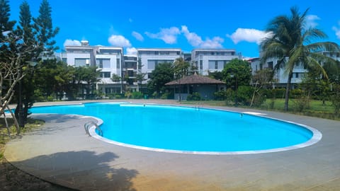 Seasonal outdoor pool, open 7:00 AM to 6:00 PM, pool umbrellas