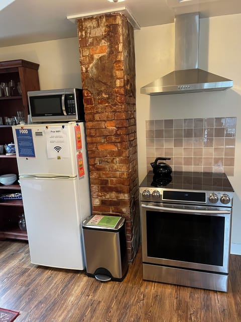 Full-size fridge, microwave, toaster, cleaning supplies