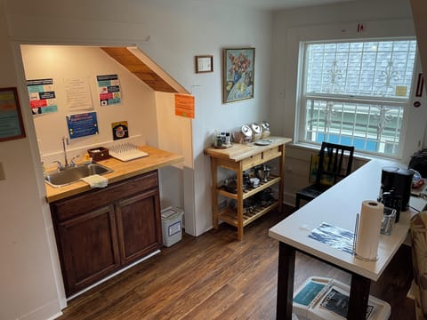 Full-size fridge, microwave, toaster, cleaning supplies